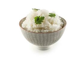 Cooked rice in bowl isolated on white background photo