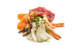 Salmon tuna smoked eel shrimp as asian sea fish salad. photo
