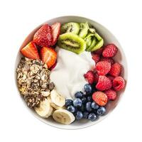 Top view of isolated fruit and yoghurt bowl with cereals, kiwi, strawberries, banana, blueberries and raspberries photo