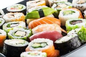 Assortment of japanese sushi rolls nigiri sashimi and maki photo