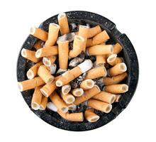 Isolated ciggarette ashtray full of butts and ash photo