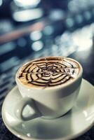 Coffee art artistic pattern on latte or cappuccino photo