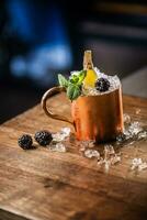 Moscow mule cocktail alcoholic drink on bar counter in pub or restaurant. photo