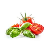 Close-up fresh tomato with basil isolated on fhite background photo