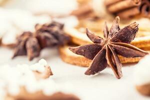 Cinnamon star anise gingerbread dry orange with christmas decoration photo