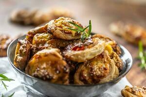 Pizza rolls stuffed with various ingredients, prosciutto bacon spinach basil mozzarella or parmesan cheese photo