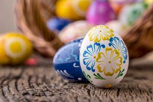 Easter. Hand made easter eggs on old wooden table. photo