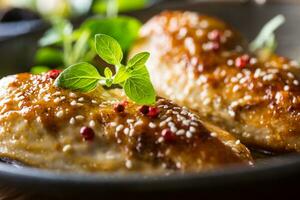 Roasted chicken breast sesame oregano and pepper in pan photo