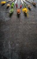 Spices and herbs for cooking on dark background - Top of view photo