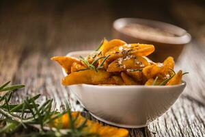 Potatoes. Roasted american potatoes with rosemary salt and cumin photo