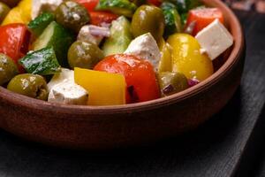 Delicious fresh, juicy Greek salad with feta cheese, olives, tomatoes, cucumber photo