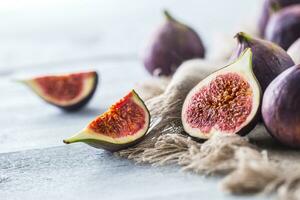 A few figs freely lying on old wooden table photo