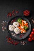 Delicious healthy steamed chicken cutlets or minced meatballs photo
