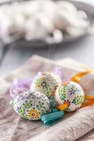 Handmade colorful easter eggs on a linen napkin photo