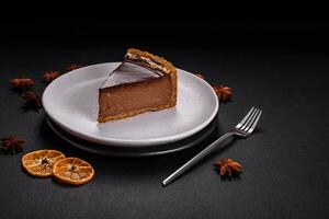 Delicious, fresh, sweet chocolate cake with nuts cut into slices photo