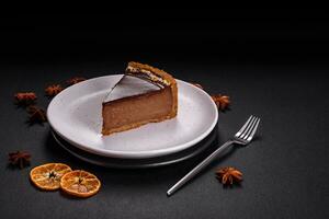 Delicious, fresh, sweet chocolate cake with nuts cut into slices photo