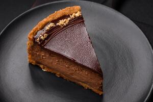 Delicious, fresh, sweet chocolate cake with nuts cut into slices photo