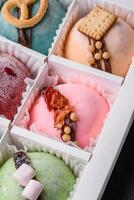 Delicious sweet colorful mochi desserts or ice cream with rice dough and toppings photo