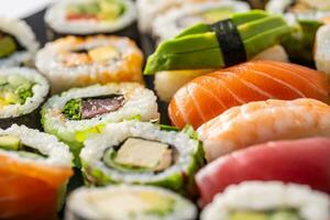 Assortment of japanese sushi rolls nigiri sashimi and maki photo