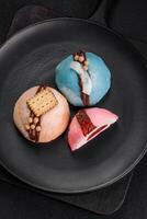 Delicious sweet colorful mochi desserts or ice cream with rice dough and toppings photo