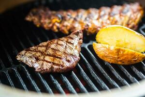 Close-up Beef flank steak cooking on grill photo