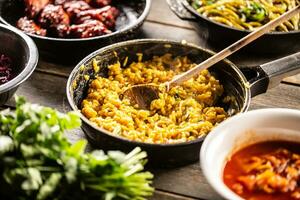 Italian creamy risotto with saffron , turmeric, or butternut in a pan with a wooden spoon photo