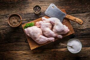 Chicken legs. Raw chicken legs with salt pepper and herbs. photo