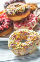 Sweet glazed donuts on table - Close up photo