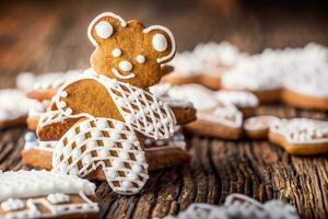 Christmas. Gingerbread family with christmas tree and christmas pastry photo