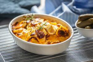 Roasted potatoes in baking dish traditional easten european food titled as france potato photo