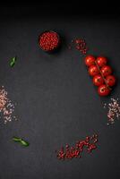 Ingredients for cooking cherry tomatoes, salt, spices and herbs photo