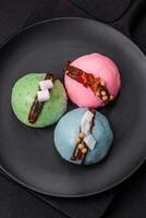 Delicious sweet colorful mochi desserts or ice cream with rice dough and toppings photo