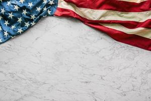 Close-up american flag on white marble background photo