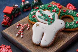 Beautiful festive Christmas gingerbread made by hand with decoration elements photo