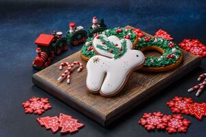 Beautiful festive Christmas gingerbread made by hand with decoration elements photo