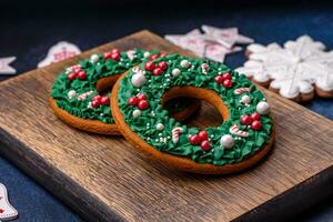 Beautiful festive Christmas gingerbread made by hand with decoration elements photo