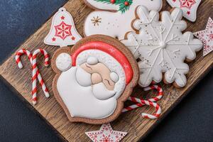 Beautiful festive Christmas gingerbread made by hand with decoration elements photo