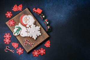 Beautiful festive Christmas gingerbread made by hand with decoration elements photo