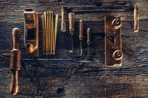 Top of view vintage carpenter tools in a carpentry workshop photo