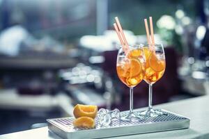 Aperol spritz drink on bar counter in pub or restaurant photo