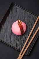 Delicious sweet colorful mochi desserts or ice cream with rice dough and toppings photo