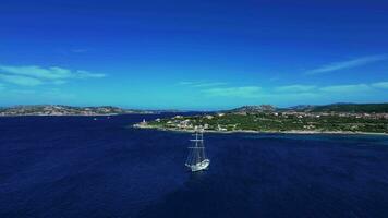Aerial orbiting view of sailing boat in Sardinia video