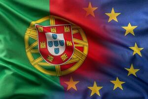 Flags of Portugal and EU blowing in the wind photo