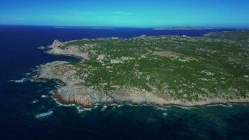 Aerial orbiting view of sea coast and cliff in Sardinia video