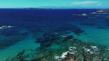Aerial orbiting view of sea coast with rocks in Sardinia video