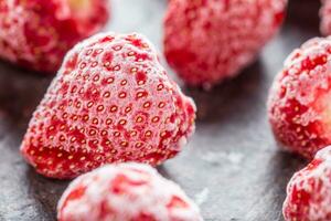 Close-up frozen strawberries covered by frost. photo