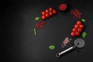 Ingredients for cooking cherry tomatoes, salt, spices and herbs photo