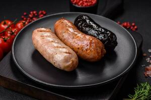 Delicious juicy sausages of several varieties grilled with salt, spices and herbs photo