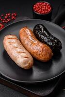 Delicious juicy sausages of several varieties grilled with salt, spices and herbs photo