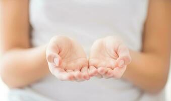 Empty young woman hand -  charity care or poverty concept photo